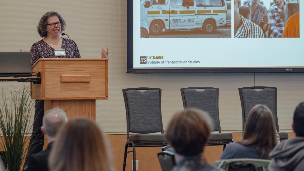Transit research symposium speaker at the podium