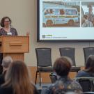 Transit research symposium speaker at the podium