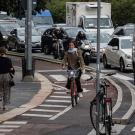 bike lane with pedestrians and car traffic